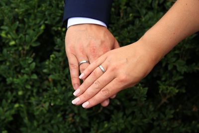 Midsection of woman holding hands