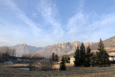 Panoramic shot of land and mountains against sky