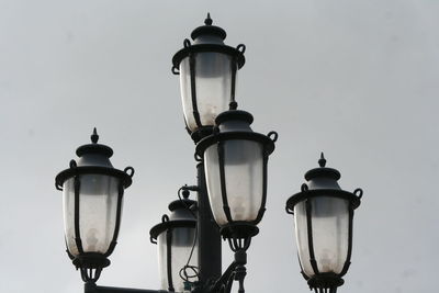 Low angle view of lanterns against sky