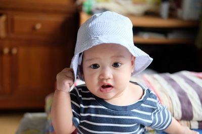 Portrait of cute baby at home