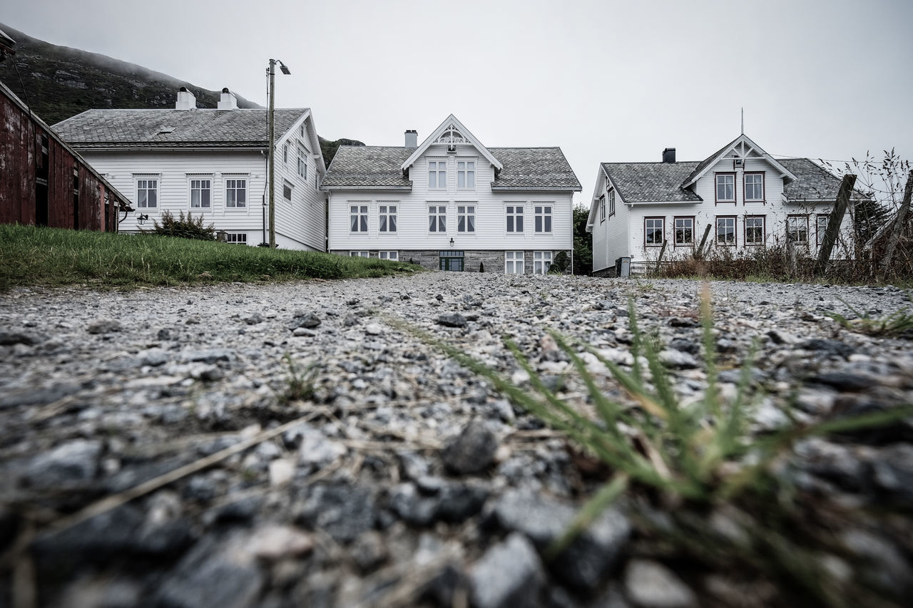 VIEW OF HOUSES AGAINST BUILDINGS