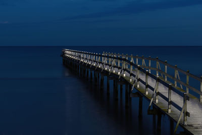 Pier over sea against sky