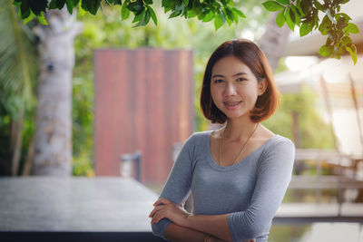 Portrait of young woman using smart phone