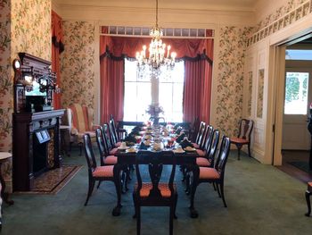 Empty chairs and tables in restaurant