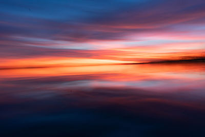 Scenic view of sea against romantic sky