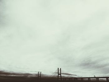 Low angle view of building against cloudy sky