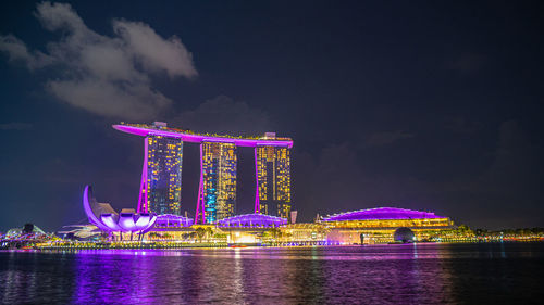 Illuminated city at waterfront
