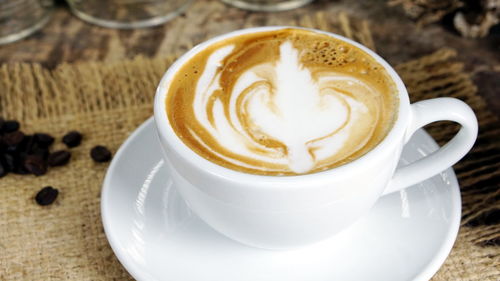 Close-up of cappuccino on table