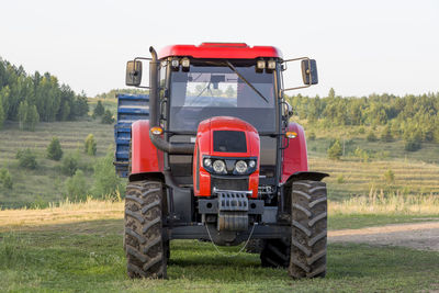 Tractor on field against sky