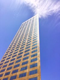 Low angle view of modern building against blue sky