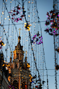 Low angle view of illuminated lights against building