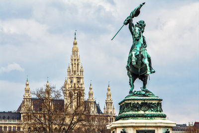 Scenic view of famous rathaus tower against erzherzog karl, wien, austria