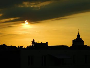 Silhouette of building at sunset