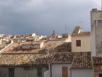 Houses in town against sky