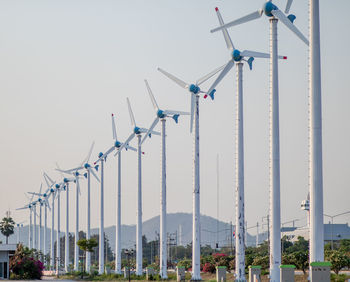 Low angle view of wind turbine against clear sky