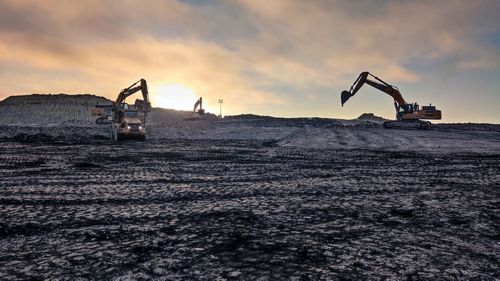 Construction site on field against sky during sunset, coal mine in kalimantan june 2021