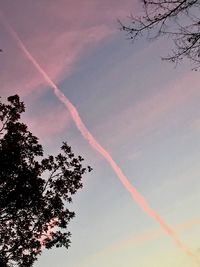 Low angle view of vapor trails in sky