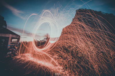 Light trails against sky at night