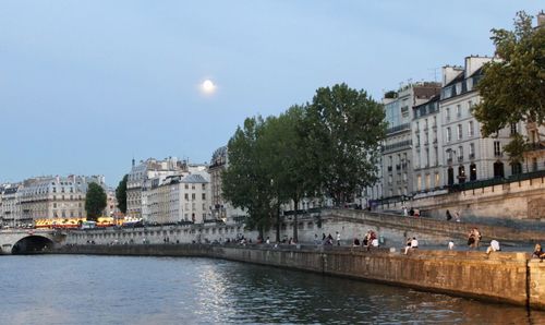 Bridge over river with buildings in background