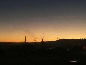 Silhouette of trees against sky during sunset