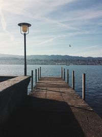 Pier on sea against sky