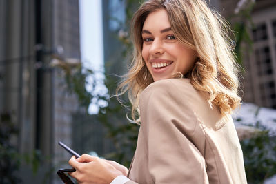 Young woman using mobile phone