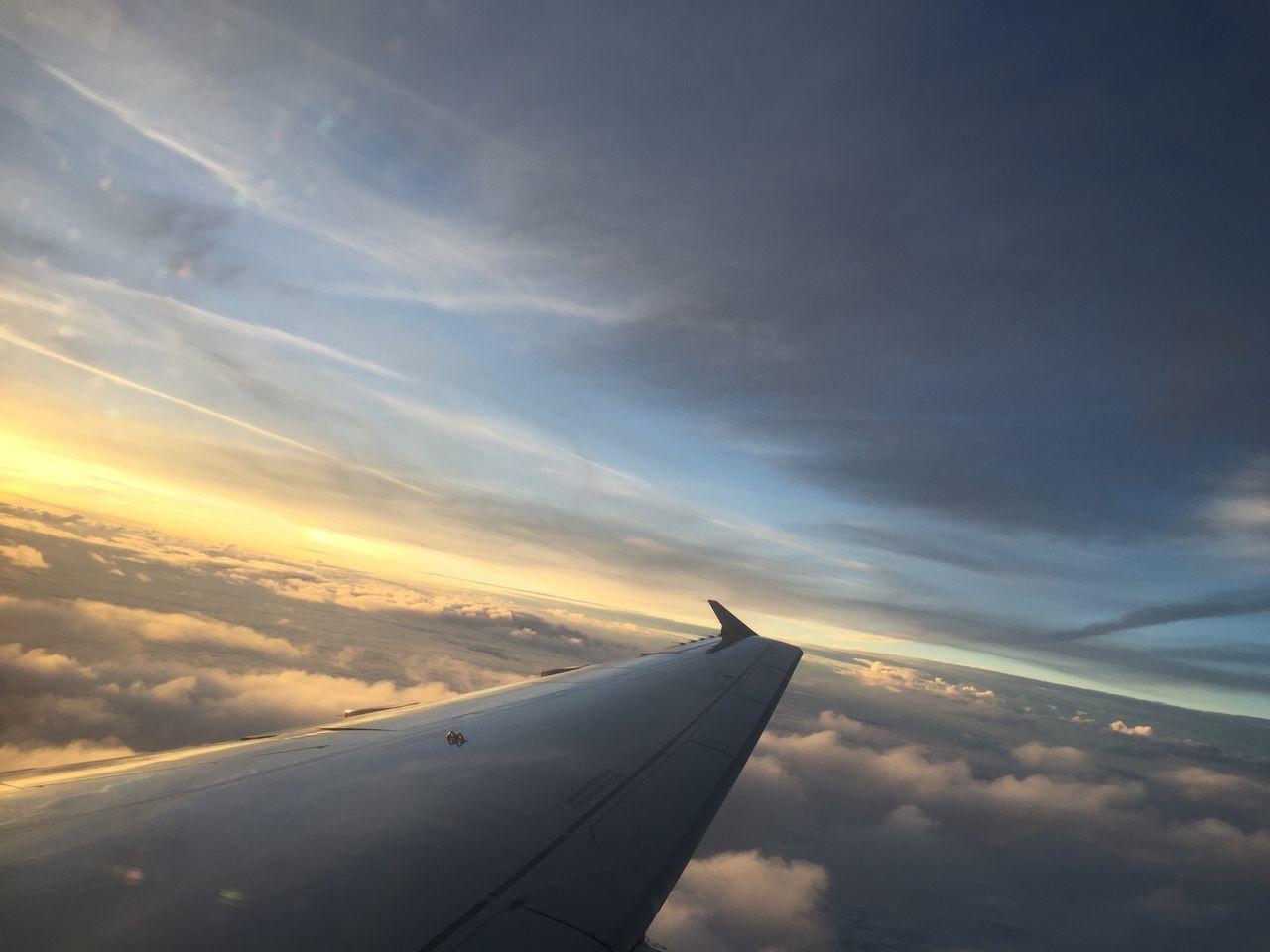 airplane, transportation, flying, air vehicle, mode of transport, aircraft wing, mid-air, sky, travel, aerial view, journey, on the move, cloud - sky, public transportation, part of, cropped, aircraft, aeroplane, commercial airplane, scenics