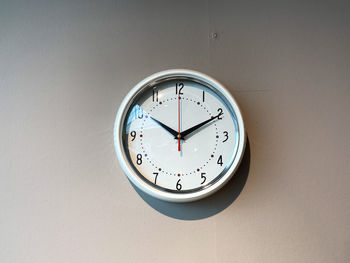 Low angle view of clock on wall