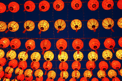 Close-up of lantern hanging against sky