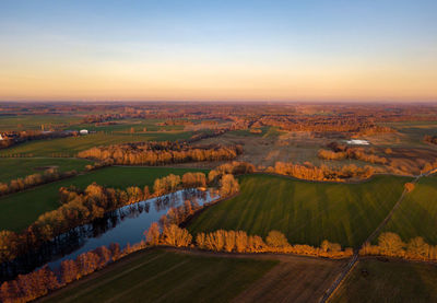 Aerial view of landscape against sky during sunset