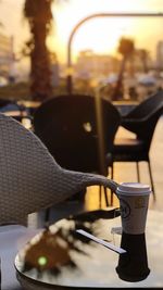 Close-up of food on table in city at sunset