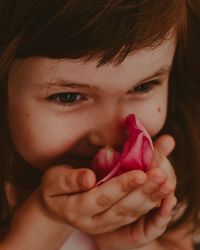 Close-up of young woman eating fruit