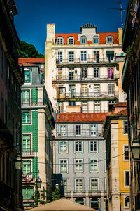 Low angle view of buildings in city against sky