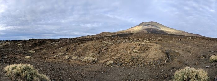 View of volcanic landscape against sky