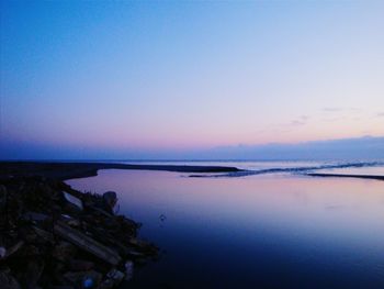 Scenic view of sea against sky at sunset