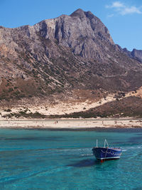 View of balos bay with a fishing boat, crete, greece
