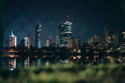 Illuminated buildings in city at night