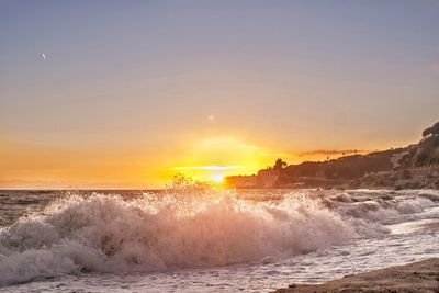 Scenic view of sea against sky during sunset