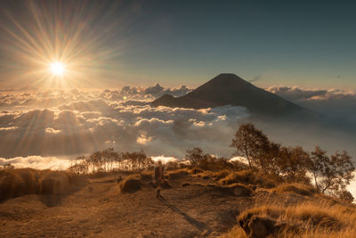 Scenic view of snowcapped mountains against sky during sunset