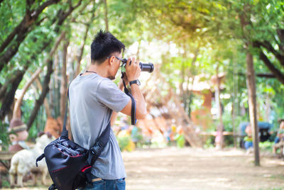 Young man photographing