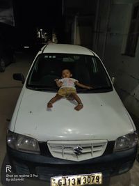 Full length portrait of boy in car