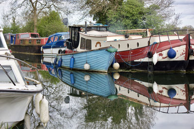 Boats moored on lake