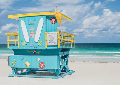 Lifeguard hut on south beach against sky