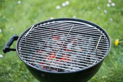 High angle view of barbecue grill on field