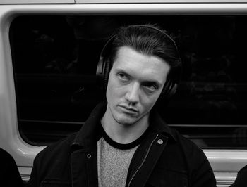 Portrait of young man in car