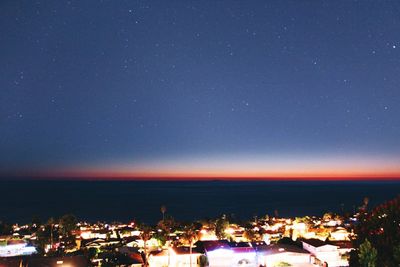 Illuminated cityscape at dusk