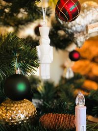 Close-up of christmas decorations hanging on tree