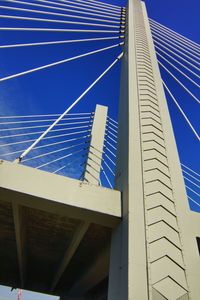 Low angle view of bridge against blue sky