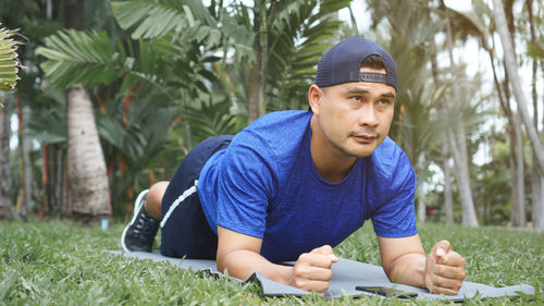 Portrait of young man sitting outdoors