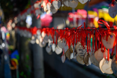 Close-up of multi colored decorations for sale at market stall
